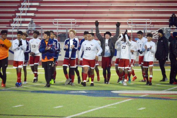 The Madisonville soccer team celebrates and thanks the fans following their 2-0 victory over Hempstead at MHS Friday. CAMPBELL ATKINS