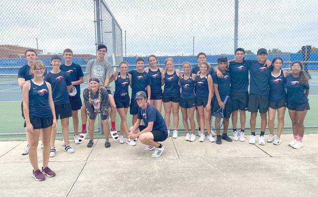 COURTESY PHOTO Members of the Madisonville tennis team pose together after defeating Burnet 10-3 Friday to become Area champs and advance to the Regional Quarterfinals, which took place Tuesday against Little River Academy.