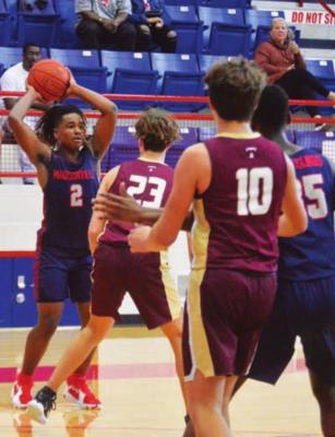 Madisonville’s Xzavier Whaley searches for an open man at MHS. CAMPBELL ATKINS