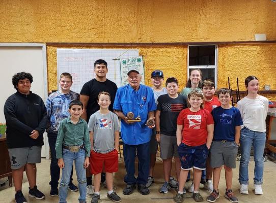 Madison County 4-H Shotgun Club thanking Coach David Radenz for his over 30 years of dedication to coaching Madison County kids to county, district and state championships. COURTESY PHOTO
