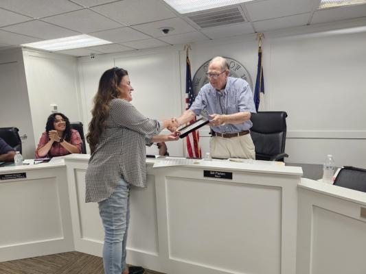 Mayor Bill Parten handed Patricia Hardy her certificate of appreciation at the city council meeting on Monday, May 13.