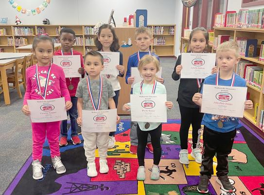 Madisonville Elementary Students of the Month for January (back row, from left) Zacharis Bacon, Zoe Avila, Aiden Crowder, Isabella Saldana, (front row, from left) Carolina Vazquez, Miles Lindsey, Brooke Renner and John-Dale Holder pose together with their certificates. COURTESY PHOTO