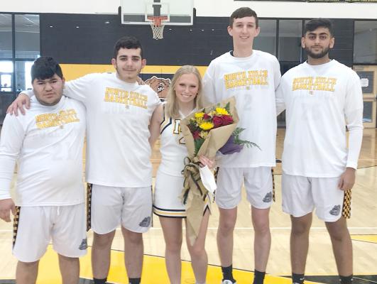 North Zulch senior basketball players (from left) Ryan Laurel, Dylan Drake, Gage O’Neal and Ali Sunny and cheerleader Tessah Haggard (middle) pose together after Saturday’s senior day ceremony at NZHS. CAMPBELL ATKINS