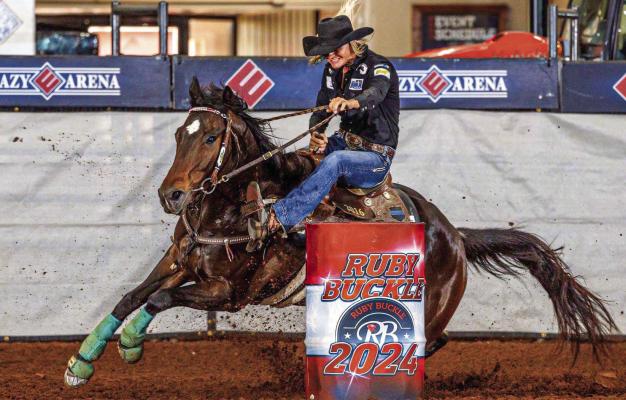 Michelle Alley rounds a barrel on her horse Lipstick N Stilettos during the Ruby Buckle Central Race 2024. Alley, who trains horses at her facility west of Madisonville, has advanced to the semi-finals at the Houston Livestock Show and Rodeo.
