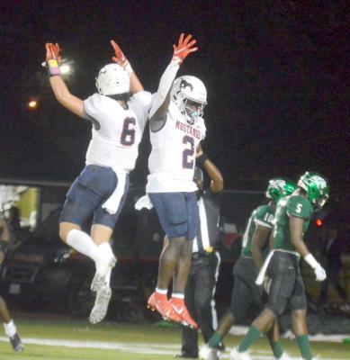 Cody Borgfeld (6) and Doug’kyrn Johnson celebrated midair following a Madisonville touchdown in the second quarter Friday. PHOTO BY CAMPBELL ATKINS