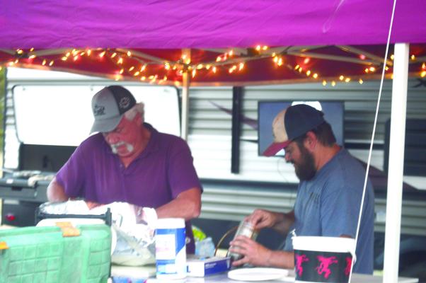 Ronald Thompson and his other cook, preparing for the event.