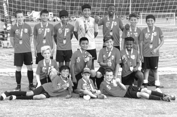 FC Mustangs pose together after winning the South Texas Cup State Finals in Temple. COURTESY PHOTOS
