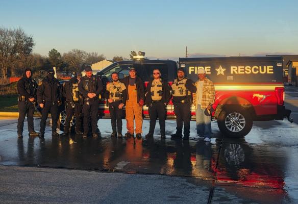 PHOTO COURTESY OF MADISON COUNTY SHERIFF'S OFFICE Madison County Sheriff's Office deputies and Madisonville Fire/Rescue firefighters pose Monday, Jan. 26 after a burst pipe set off fire alarms and flooded the parking lot. No water entered the building, but the friendly ribbing between the two departments was unavoidable. fects more than 1,500 Entergy customers in the area.