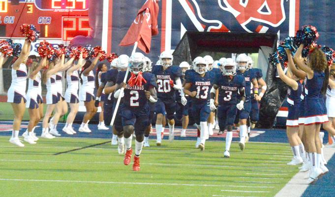 The Madisonville football team storms out of their bye with a road matchup in Shepherd to open district play Friday at 7:30 p.m. Both the Mustangs and Pirates went 2-3 during their pre-district season matchups. (Pictured: Doug'kyrn Johnson leads the Mustangs through the tunnel during the team's homecoming matchup at MHS Sept. 17) PHOTO BY CAMPBELL ATKINS