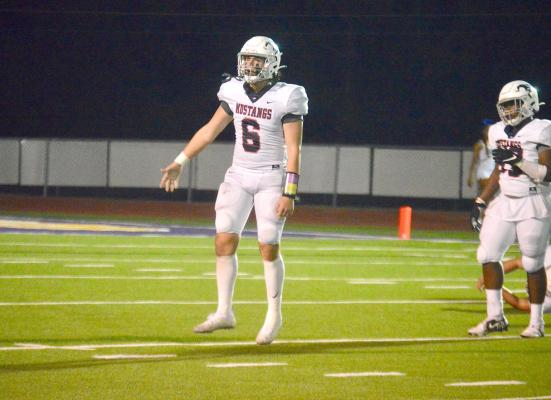 Linebacker Cody Borgfeld pumps up the crowd following a stop on fourth down late in the game Friday at Center. CAMPBELL ATKINS