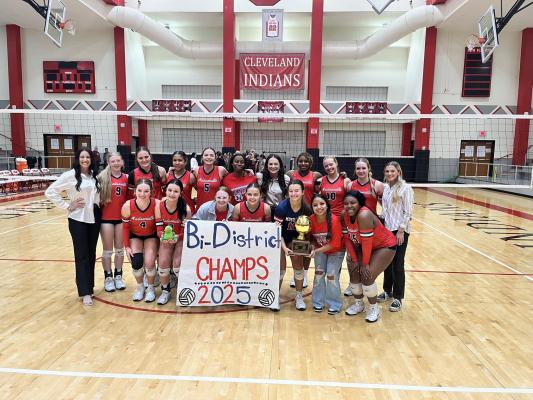 The Varsity Lady Mustangs volleyball team poses with its bi-district championship trophy after defeating Silsbee Thursday, Oct. 30 at Cleveland High School. The team finished district play with an 8-2 record and entered the playoffs as the top seed in Division 2. PHOTO COURTESY OF MHS