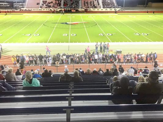 Madisonville football seniors line up together with their families prior to Friday’s matchup against Carthage. CAMPBELL ATKINS