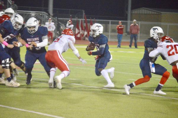 Madisonville’s Jeramiah Burns searches for a hole against Carthage Friday at MHS. CAMPBELL ATKINS