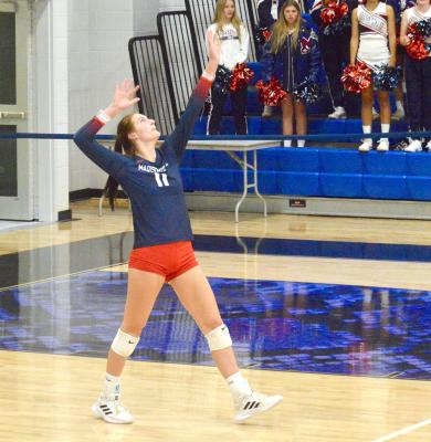 Zaylea Brunette delivers a serve in Navasota against Giddings Thursday. CAMPBELL ATKINS
