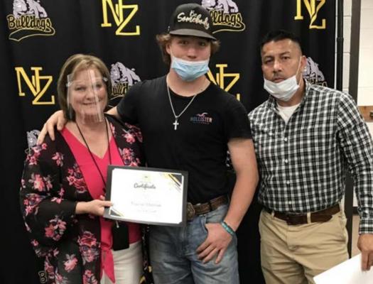 North Zulch High School Student of the Month Trainer Malinak poses with Principal Janie Pope and Assistant Principal Pete Martinez at the district’s monthly meeting for March Thursday. COURTESY PHOTO