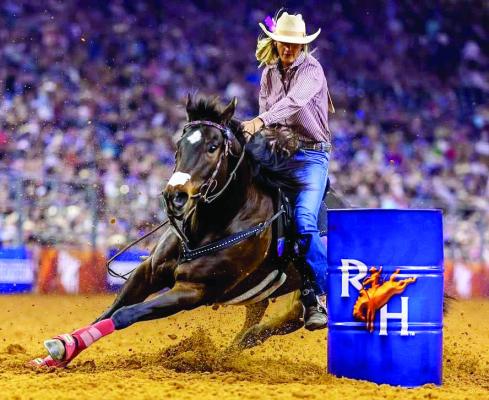 Madisonville barrel racer Michelle Alley leans into a turn aboard Lipstick N Stilletos during Super Series 1 competition at the Houston Livestock Show and Rodeo. Alley won all three rounds March 2 through March 4, earning $9,000 and a spot in the Semifinals. COURTESY PHOTO