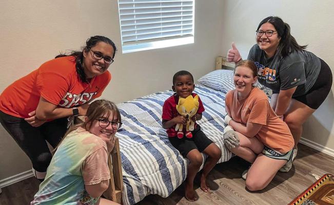 Cheyanne Snook (middle) with the Sam Houston State University student group on their first SHP delivery in Montgomery County. COURTESY PHOTOS