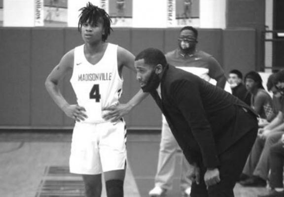 Madisonville’s Casey Holiday, who totaled 18 points and 17 rebounds in the team’s upset victory over La Vega Jan. 26, discusses strategy with Coach Brad Taylor during a break in the action. CAMPBELL ATKINS