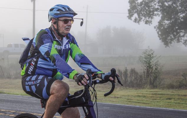 Cyclists brave the thick morning fog during the annual Tour de Madison on Saturday, Oct. 12. The event, organized by the NAACP, raises scholarship funds for Madisonville High School graduates. METEOR PHOTOS BY RICHARD SIRMAN