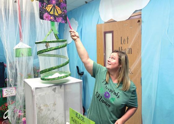 Elementary kids release butterflies