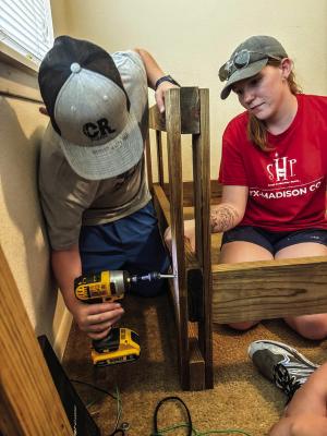 Crossroads youth build beds for kids in need