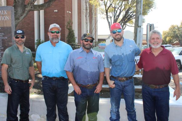 Madisonville Sidewalk Cattlemen's Association President Blake Pipes (left) stands with past presidents Danny Wilkerson, Matt Clark, DL Shiver, and Brent Viator at the Madison County Courthouse horse trough on Friday, March 20.  