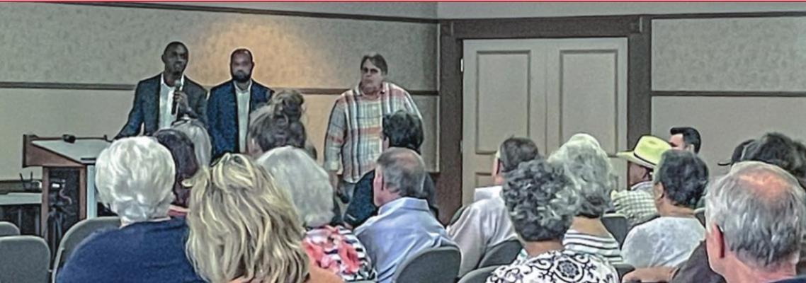 Madisonville City Manager Fabrice Kabona, Abdi Yassin of Muni-Cap and Charles Von Schmidt, President and Managing Director of Waterstone Development Group field questions from Madisonville citizens at the Kimbro Center Thursday. CAMPBELL ATKINS