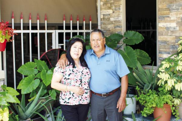 Maria Luisa and Emilio Estrada stand outside Los Ranchos, the Madisonville restaurant they opened in 2005 and have run as a family for 20 years. METEOR PHOTO BY RICHARD SIRMAN