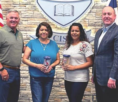 Madisonville CISD Employees of the Month, the mother-daughter duo of Rebeca Reyes and Maribel Penaloza, pose together with Superintendent Keith Smith (left) and Board Member Dale Hurst. AMPBELL ATKINS