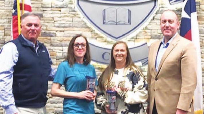 Madisonville CISD Employees of the Month Stacy Stubblefield (left) and Toni Campbell pose with Superintendent Keith Smith (left) and board member Dale Hurst. CAMPBELL ATKINS