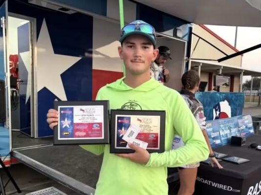 Madisonville High School senior Dustin Beggs holds his fifth place and boat captain plaques at a Texas High School Bass Association awards ceremony. COURTESY PHOTO