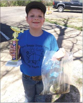 Dillon Callaham, a second grade student at Madisonville Elementary, participated in the annual Ft Boggy Annual Kid Fish Saturday, Feb. 24. Callaham caught 4 perch in less than an hour, winning him the 1st place trophy, in the 7-8 years old division. COURTESY PHOTO