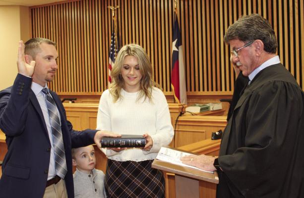 Madison County Judge Clarke Osborne administers the Oath of Office to Pct. 1 Madison County Constable Aaron Campbell. Constable Campbell is serving his inaugural term as constable.