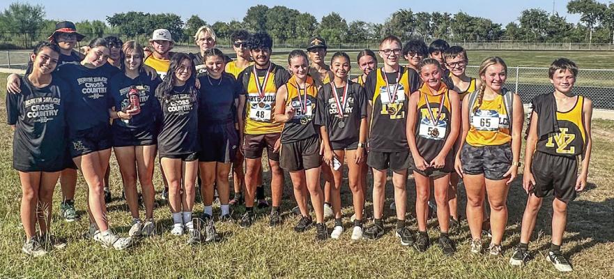 The North Zulch High School varsity girls cross country team celebrates their second-place finish at the 29-1A district meet in Fayetteville on Thursday, Oct. 10. Team members Gracie Blades, Jocelyn Cervantes, Keelea Kelly, Madelynn Kohl, Dayana Medina (who placed second overall), Joslyn Sanders, and Baylee Watkins will advance to the regional meet in Corpus Christi on Oct. 22. Wali Afshar qualified individually for the boys team. COURTESY PHOTOS