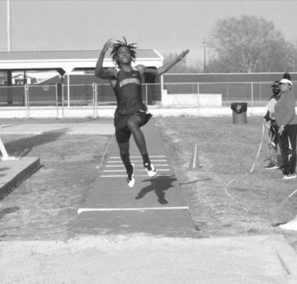 Wayne Roundtree competes in triple jump at MHS Thursday. CAMPBELL ATKINS