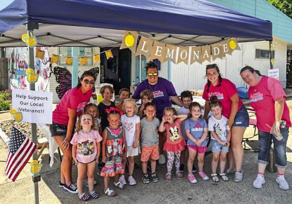The Sweet Magnolia Learning Center staff with the kids running their lemonade stand. PHOTO BY GAGE MATTHIEU