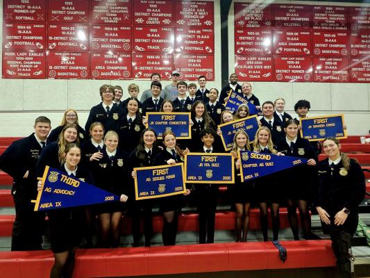 Madisonville FFA members showcase their banners after winning the Area IX sweepstakes title Nov. 21. Photo Courtesy of Madisonville FFA COURTESY PHOTO