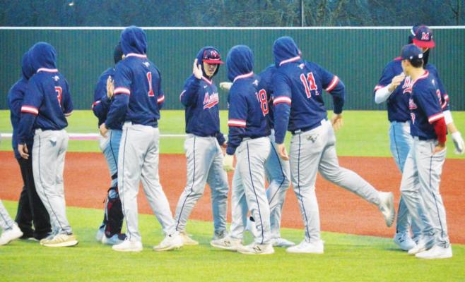 Madisonville baseball players shake hands following a 12-1 win over Fairfield at MHS Thursday. CAMPBELL ATKINS