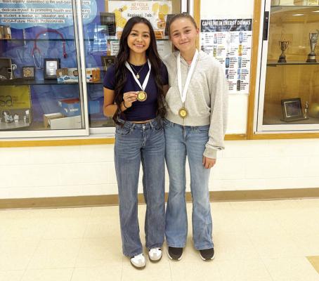 COURTESY PHOTO North Zulch cross country runners Dayana Medina and Kylie Lawson show their medals from the Anderson meet.