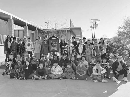 COURTESY PHOTO Cap: Members of the North Zulch Elementary Student Council pose with their newly installed Little Free Library on the NZHS campus in November.