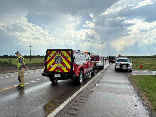 PHOTO COURTESY OF NORTH ZULCH VOLUNTEER FIRE DEPARTMENT Officials cite wet conditions in a Texas 21 crash June 2 that left a Houston man dead and a second driver hospitalized.