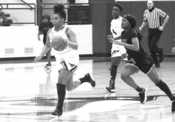 Madisonville’s Tra’Shayla Smith was honored before Friday’s Lady Mustangs’ contest on senior night Friday along with team manager La’Kyra Childress. CAMPBELL ATKINS