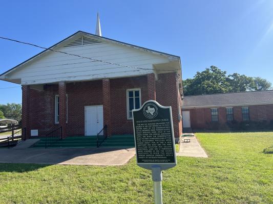 A replacement Texas Historical Commission marker stands outside Shiloh Missionary Baptist Church after a March 2022 tornado destroyed the original. The Rev. N.C. McCloud organized the church in 1885, and many of its first members were former slaves. Madison County Commissioners Court funded the replacement. 