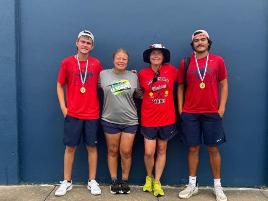 Madisonville’s Brady Railsback (left) and Joel Zavala (right) won the boys doubles championship at the UIL 4A Region III Tennis Tournament on Saturday, April 18, and advance to the UIL State Tennis Tournament. Pictured with them are Coach Lyons and Coach Sedlacek. 