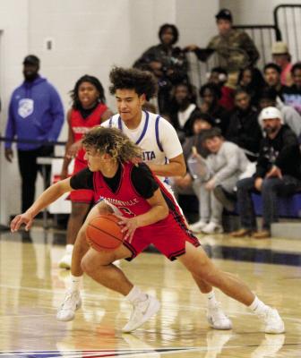 Madisonville sophomore Garrik Kovar works past a Navasota defender on Tuesday, Jan. 13. METEOR PHOTO BY MATTHEW YBARRA