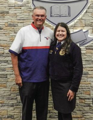 Texas FFA Ford Leadership Scholar, Joeli Hardy presents her Madison County Hay Relief Project before the board.