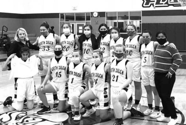 The North Zulch women’s basketball team poses together after their first playoff win in five years in Flatonia Thursday. COURTESY PHOTO