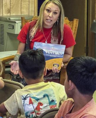 Erica Greene reading to the kids of Midway during the summer reading program