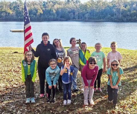 Madison County Girl Scouts Troop 9504 poses at Fort Boggy State Park during a day camp last month. Cadettes and Seniors hiked 3 miles while Daisies, Brownies and Juniors completed a 1-mile hike. The scouts earned Trail Adventure badges and completed outdoor art projects. COURTESY PHOTOS