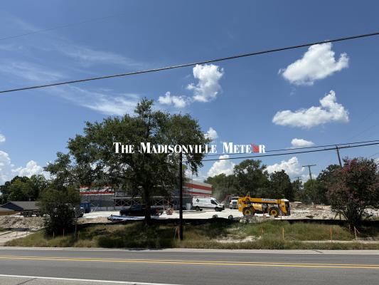 Cement truck boom strikes power line